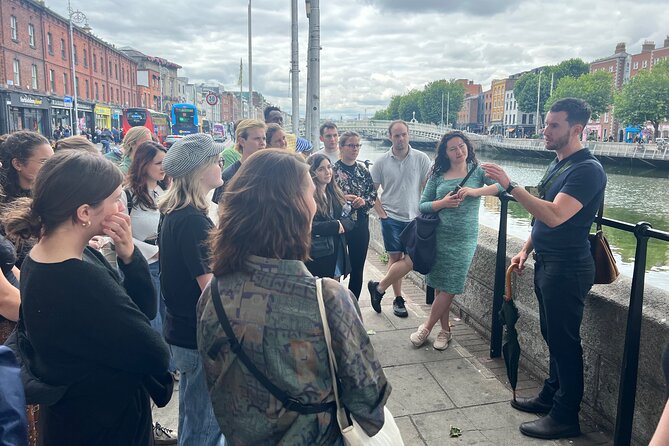 Dublin Highlights and Hidden Gems Guided Walking Tour - Crossing the Liffey by Ha’penny Bridge
